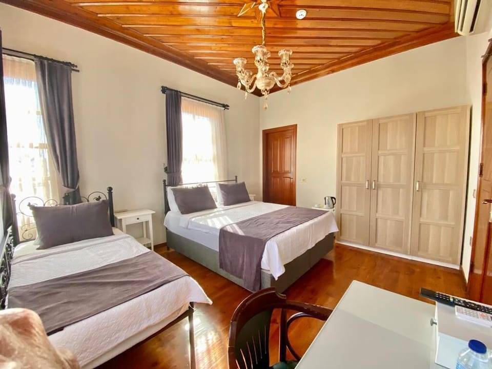 Family Triple Room, 1 Bedroom, City View | In-room safe, iron/ironing board, free WiFi, bed sheets