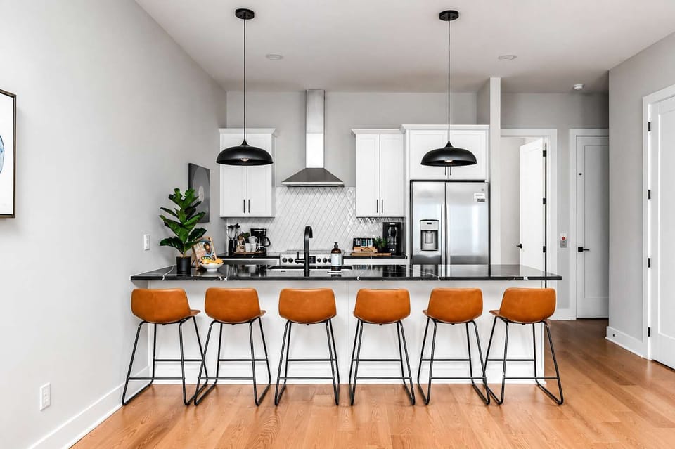 Kitchen with 6-seat island, perfect for meals and snacks.