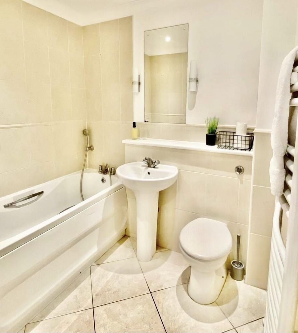 The bathroom is a well-appointed space that combines functionality with a touch of luxury.