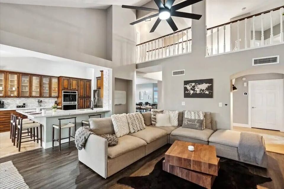 Views of living room, kitchen and the upstairs bridge