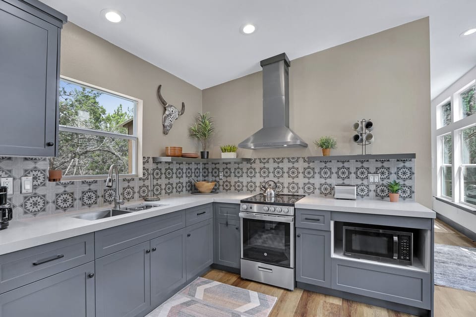 Stainless appliances-- range with oven and microwave.