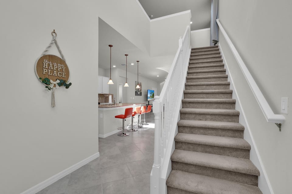 As you ascend the stairs, you'll discover the inviting loft area that awaits you