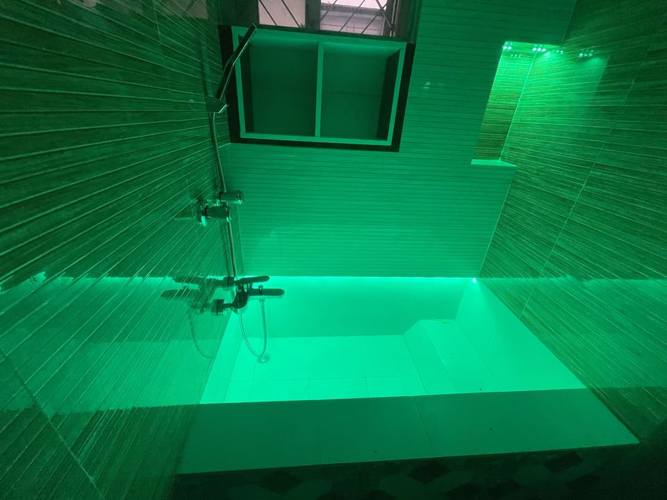 Shower, rainfall showerhead, designer toiletries, hair dryer