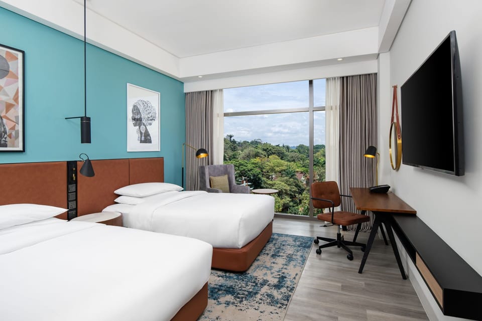 Standard Room, 2 Twin Beds, City View | In-room safe, desk, laptop workspace, blackout drapes