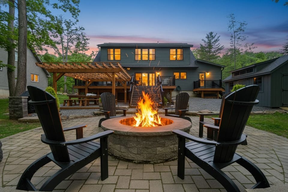 Lakefront home with built-in fire pit and spacious deck.