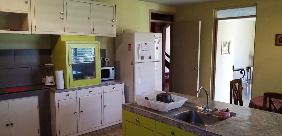 Mini-fridge, microwave, oven, cookware/dishes/utensils