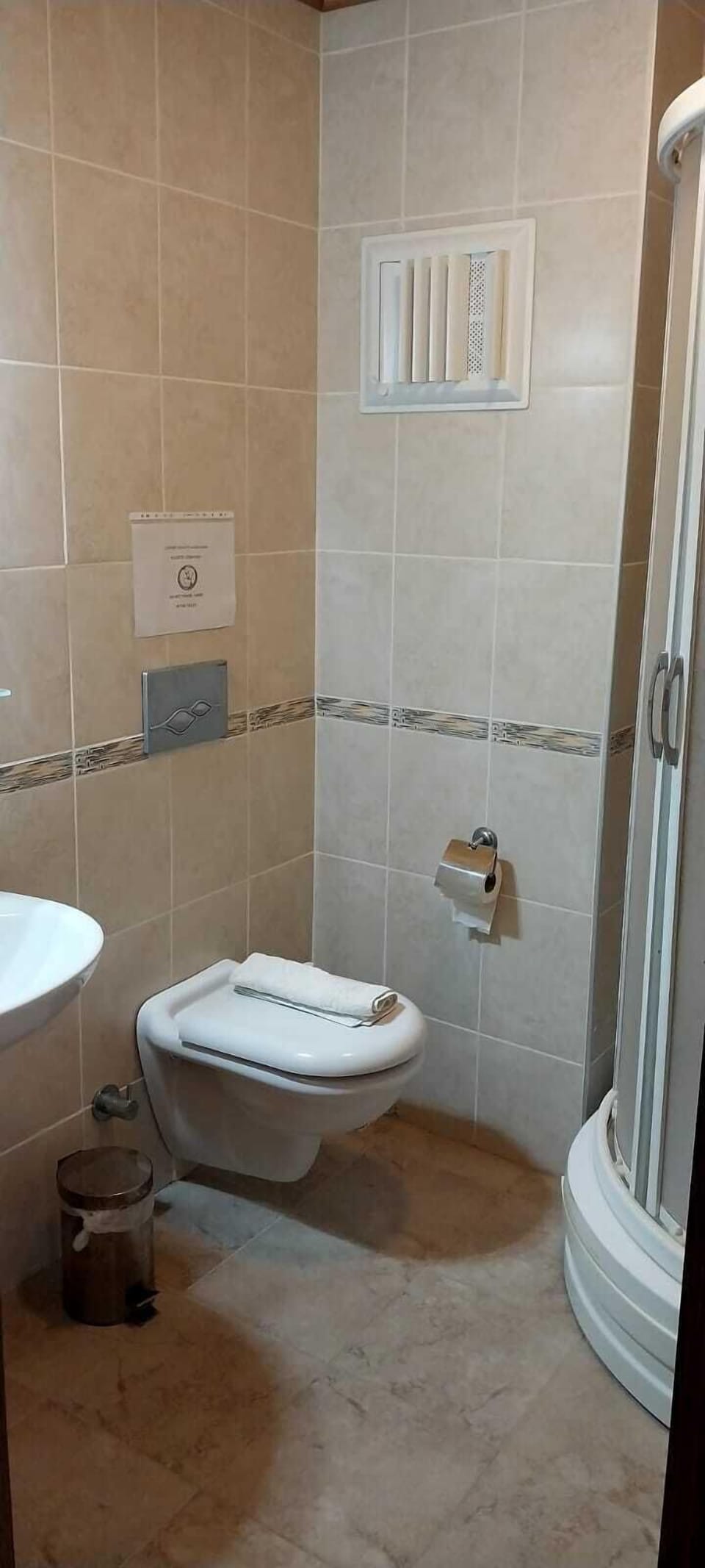 Shower, hair dryer, slippers, towels