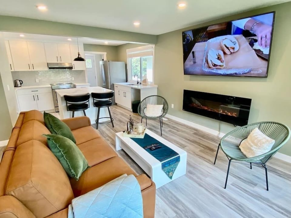 Living room with 72' electric fireplace  and LG 75' TV