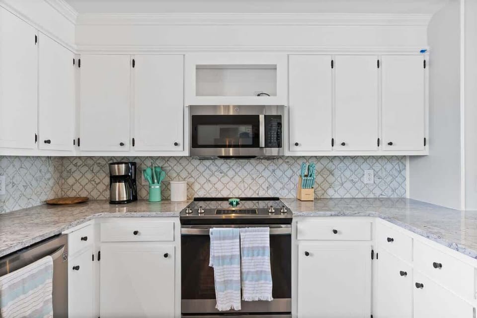 Modern appliances and stylish decor make cooking a breeze in this beach getaway!