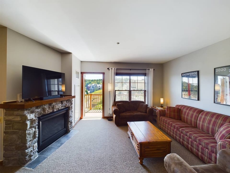 Queen sized sleeper sofa in living area.