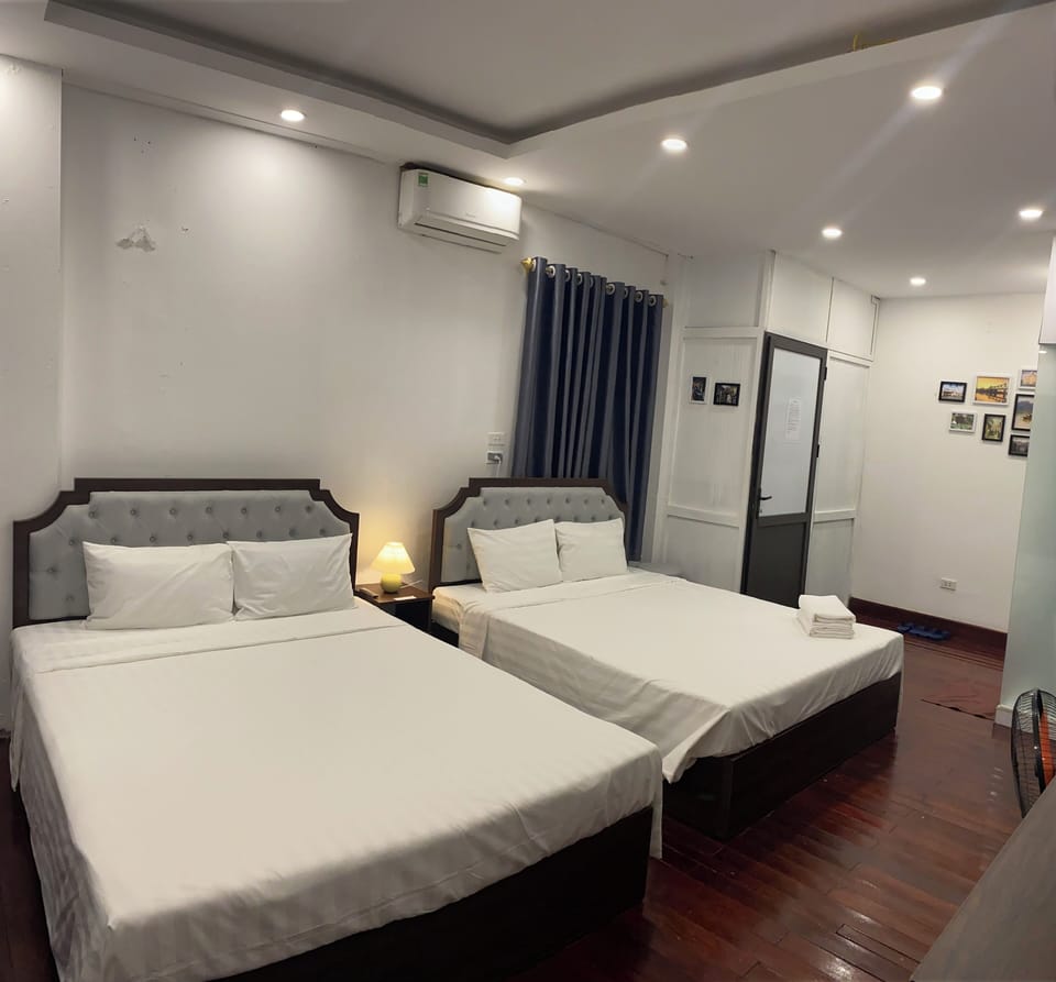 Family Room, 2 Queen Beds | Iron/ironing board, free WiFi