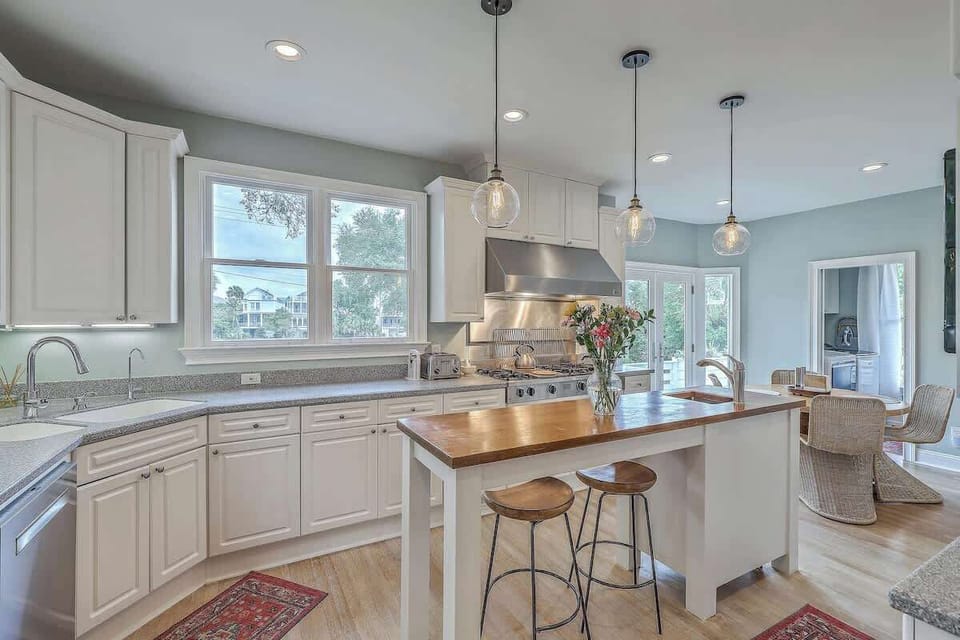 A sleek, fully equipped kitchen with updated appliances and plenty of space to cook and gather.