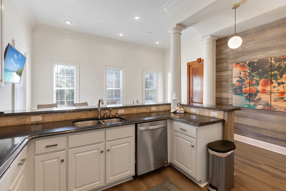 Your gourmet kitchen features granite counters, stainless appliances, and rustic wood accents—perfect for creating memorable meals together.