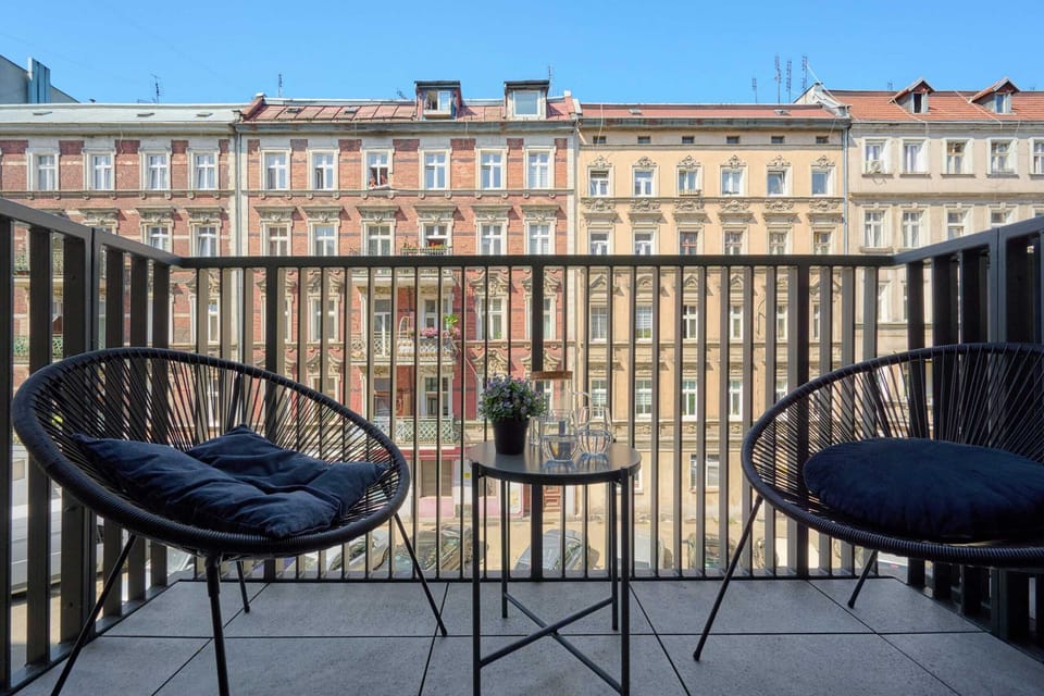 Balcony with furniture for outdoor relaxation.