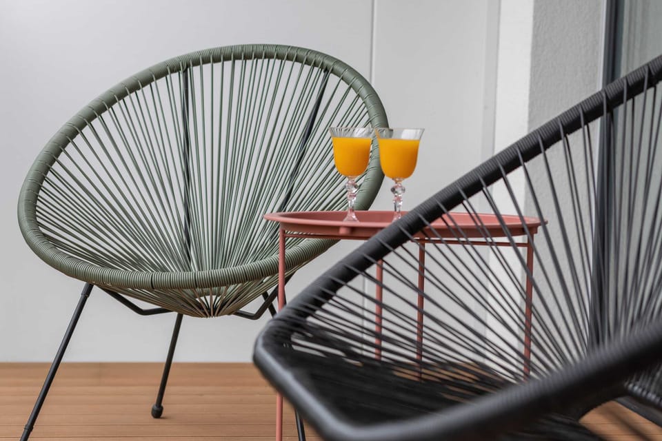 Balcony with garden furniture.