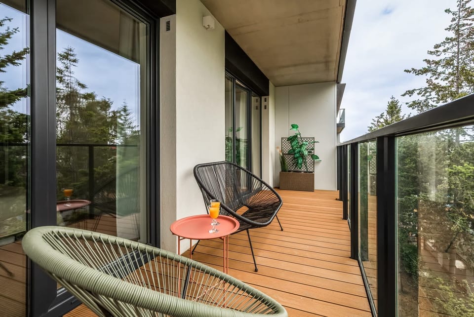 Quiet balcony with garden furniture for relaxation.