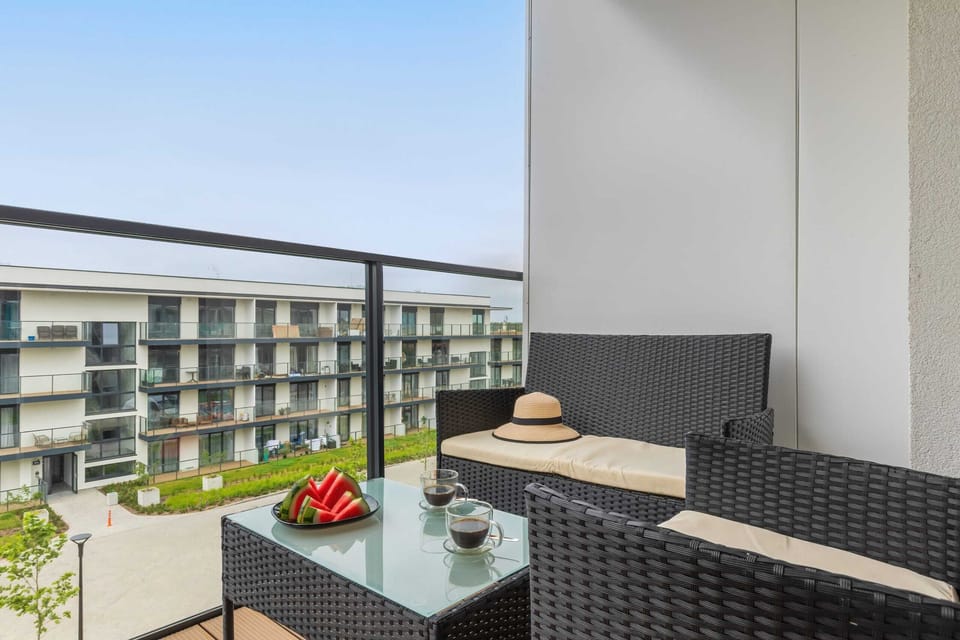 Balcony with garden furniture for relaxation.