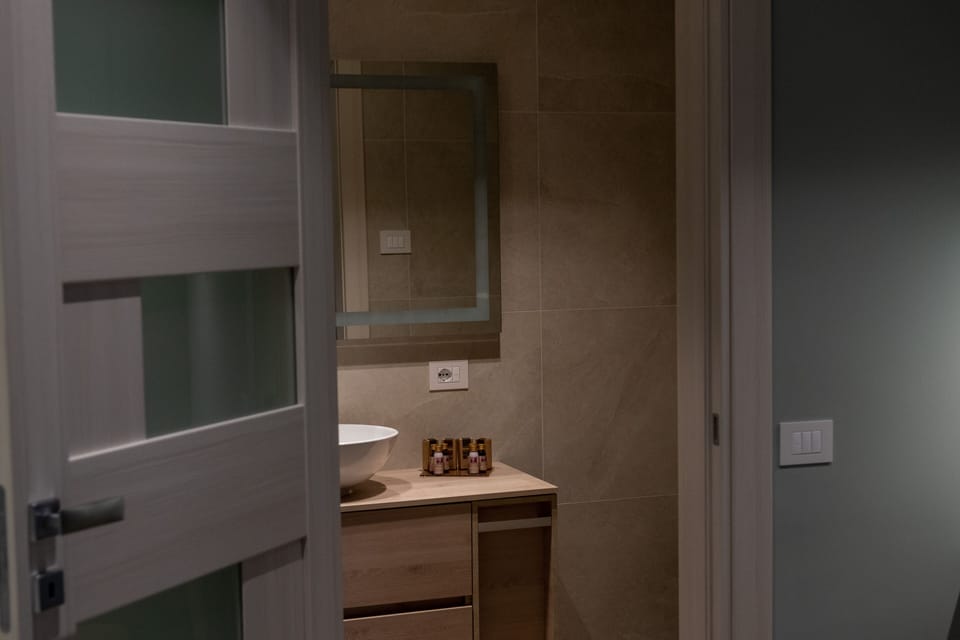 Deluxe Double Room, 1 King Bed, Refrigerator, Ground Floor | Frette Italian sheets, premium bedding, down comforters, pillowtop beds