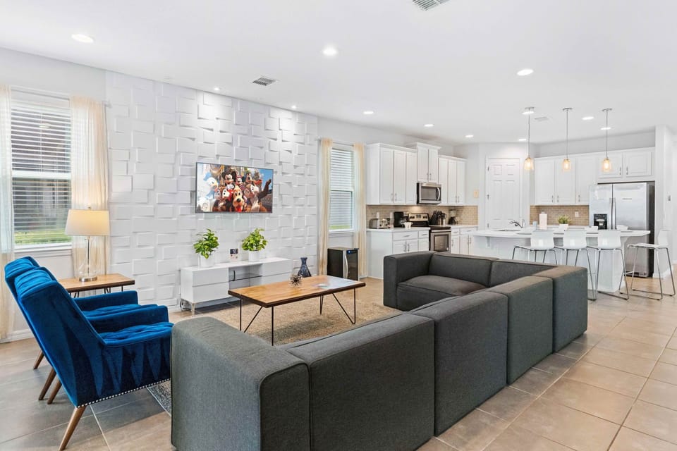Magnificent living area of the home in Kissimmee Florida - Plush and comfortable seating arrangements - Stylish, contemporary furnishings enhancing the aesthetic - Smart TV and Netflix - Flexible seating options for comfort and adaptability