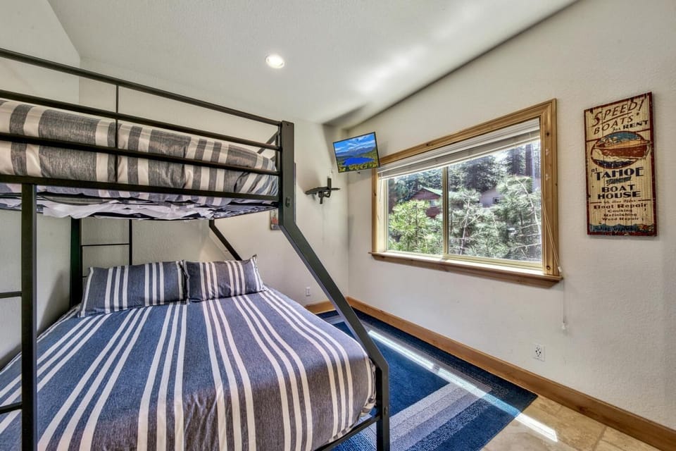 Bedroom three is downstairs, featuring a twin over full bunk and 44" Smart TV