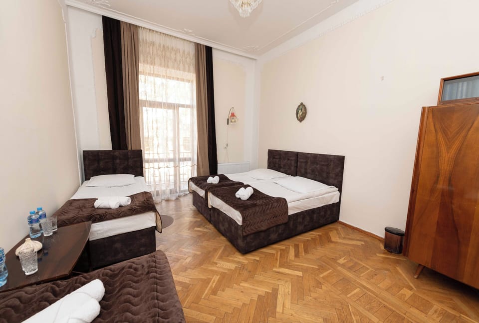 Classic Quadruple Room with Balcony (Shared Bathroom) | Individually decorated, laptop workspace, free WiFi