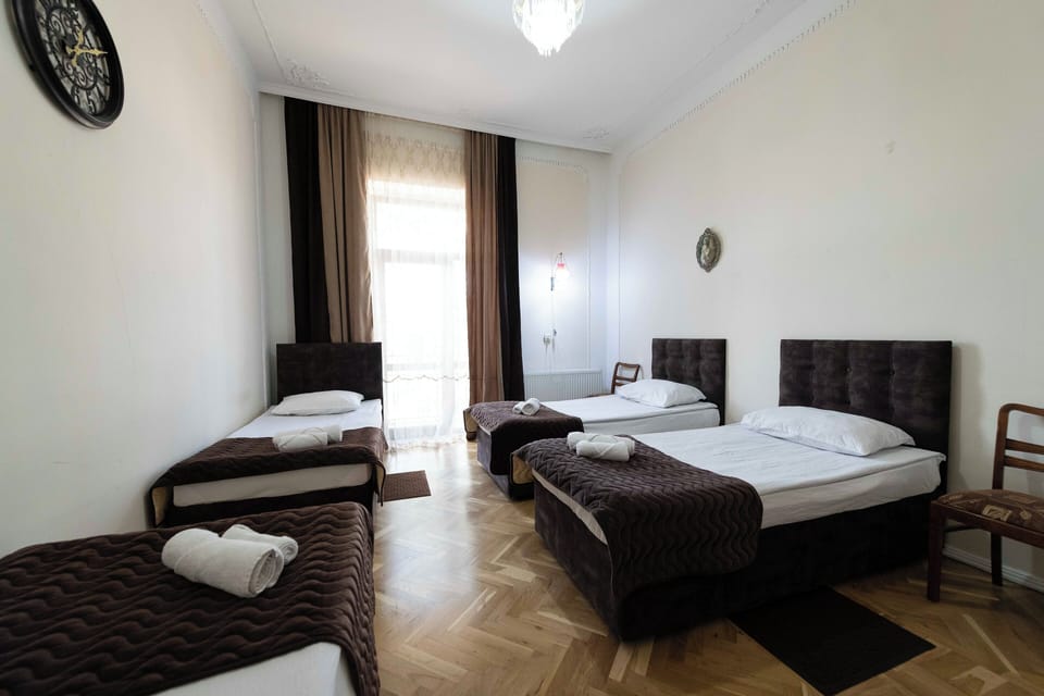 Classic Quadruple Room with Balcony (Shared Bathroom) | Individually decorated, laptop workspace, free WiFi