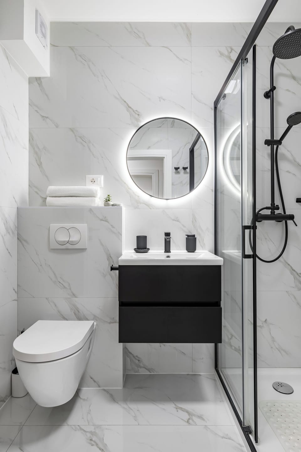 Shower, rainfall showerhead, hair dryer, towels