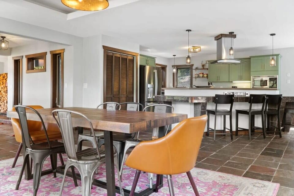 The kitchen and dining room are situated in one large space making it easy to bring dinner right to the table for a family style meal.