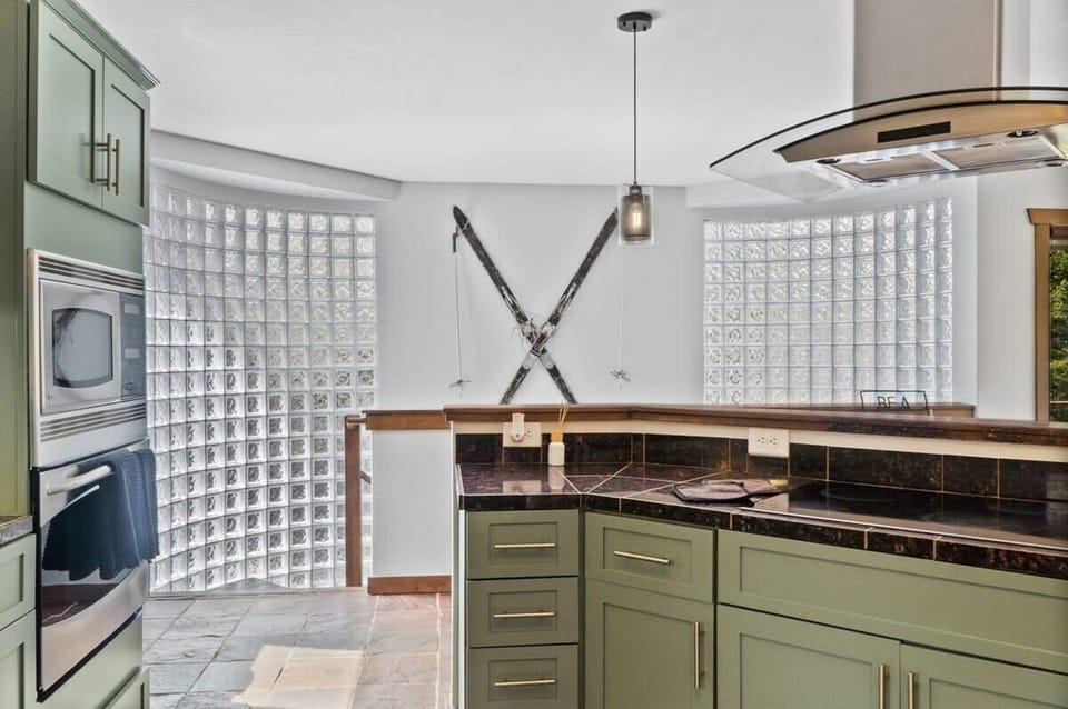 The view from the kitchen towards a set of stairs that led to one portion of the lower level of the home.