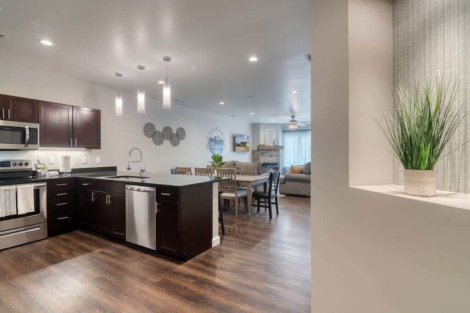 Open concept allows everyone to join on the fun, whether on the couch or in the kitchen!