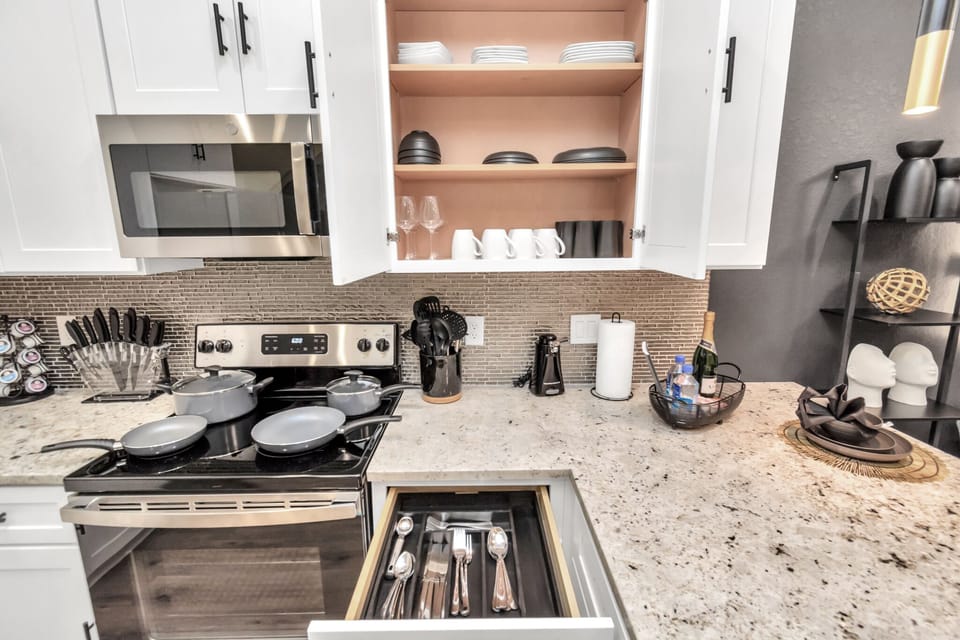 Unit A features a fully stocked kitchen, equipped with everything you need to cook and enjoy meals
