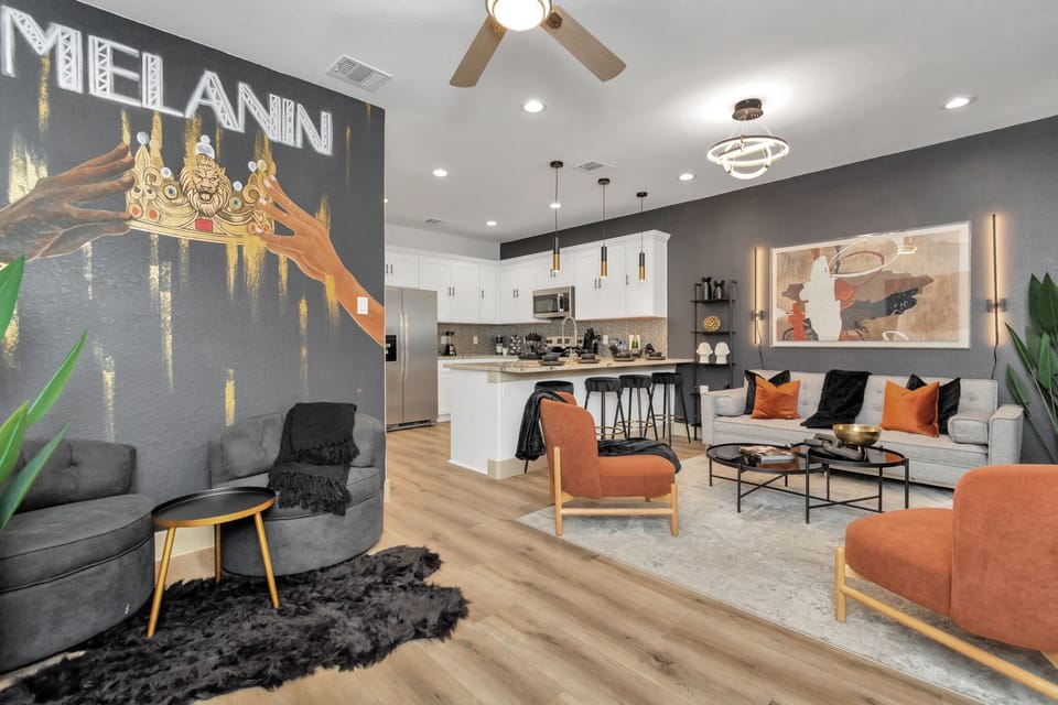 Unit A features a cozy living room with a sofa bed, 4 single-seater couches, and LED wall lights
