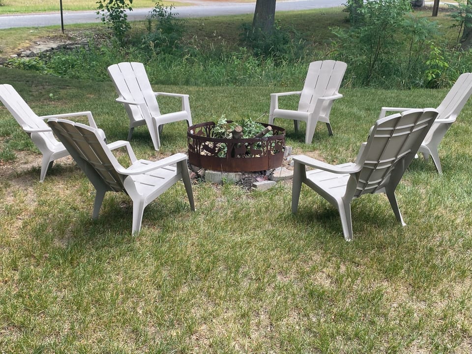 Fire pit with Adirondack chairs