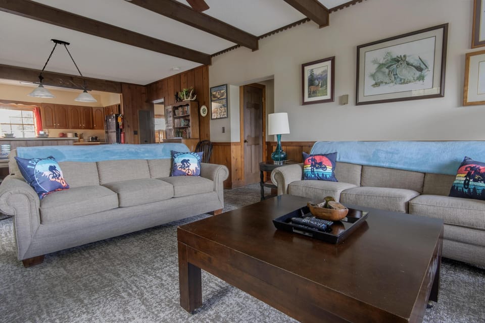 The living room has one sleeper sofa for additional sleeping capacity.