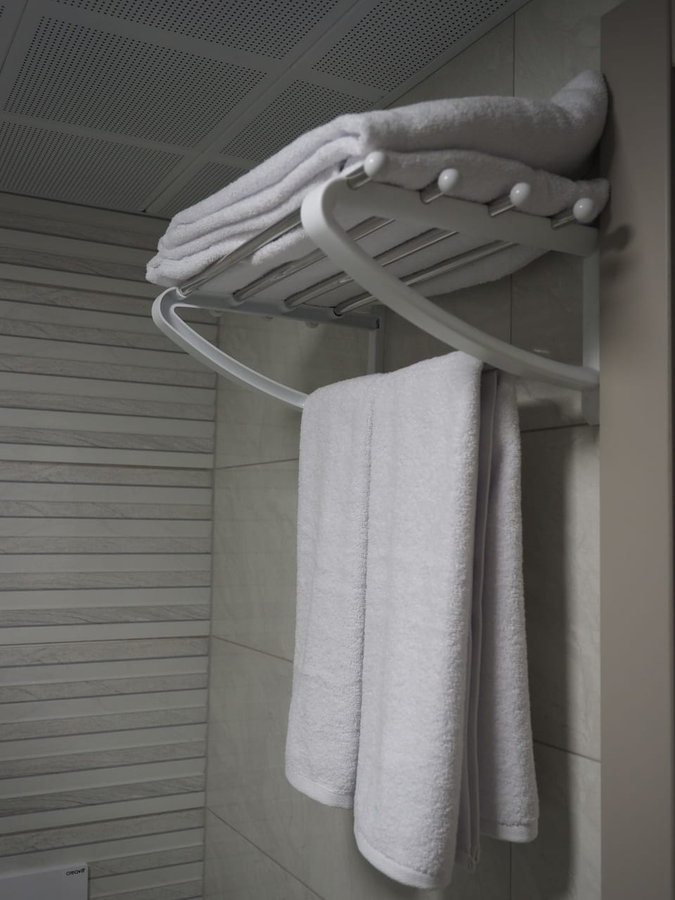 Shower, rainfall showerhead, hair dryer, towels