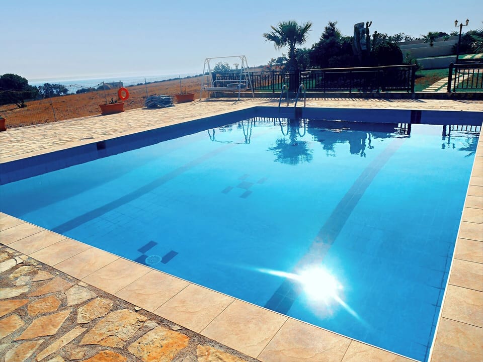 Infinity-style swimming pool with panoramic views of the Libyan Sea