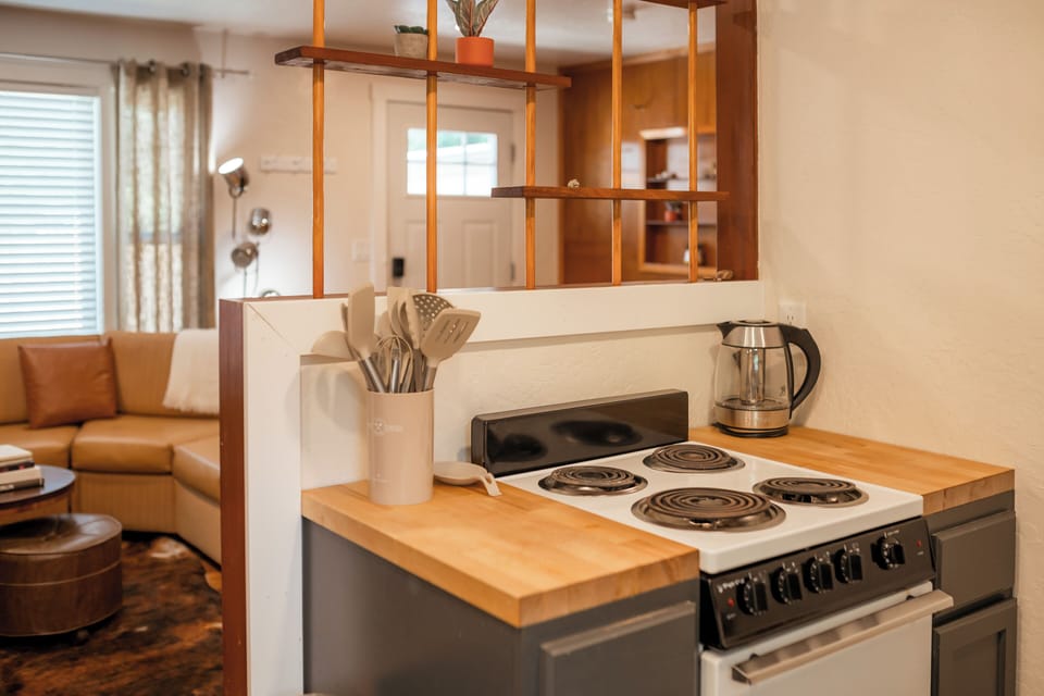 Cook up something tasty in this open, connected kitchen.
