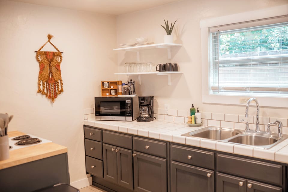 Start your day with ease—coffee, microwave, and thoughtful details included.