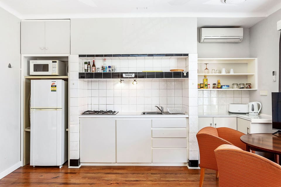 Whip up a delicious meal in this well-equipped kitchen, complete with modern appliances and ample counter space.