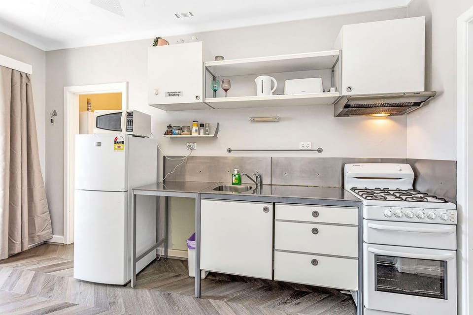 Whip up delicious meals in this well-equipped kitchen, complete with modern appliances and ample counter space.