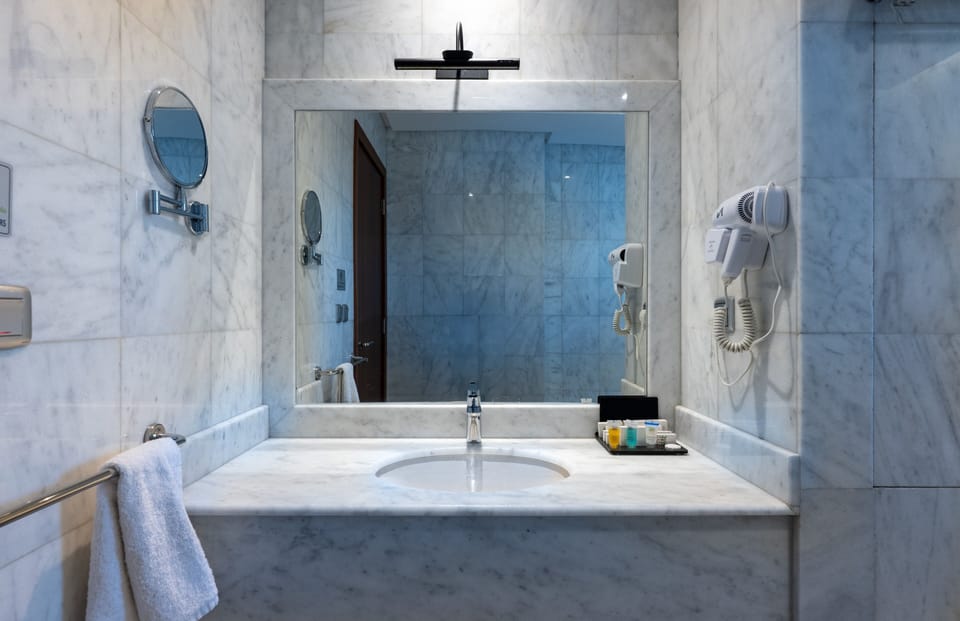 Shower, hydromassage showerhead, designer toiletries, hair dryer