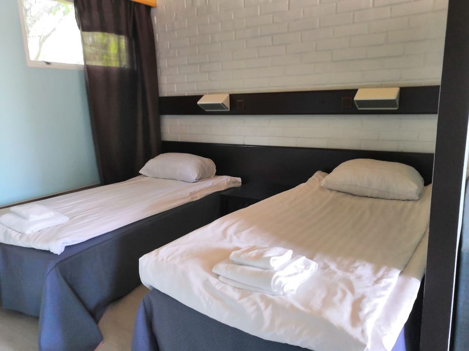 Basic Double or Twin Room | Desk, laptop workspace, free WiFi, bed sheets