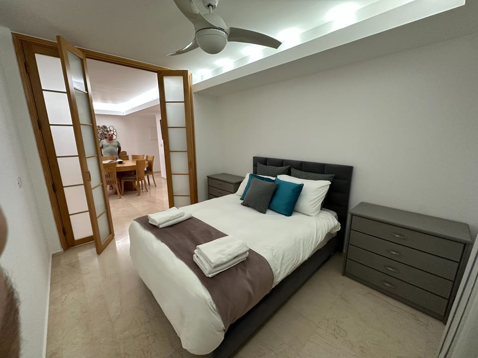 Apartment, Balcony | In-room safe, desk, iron/ironing board, bed sheets
