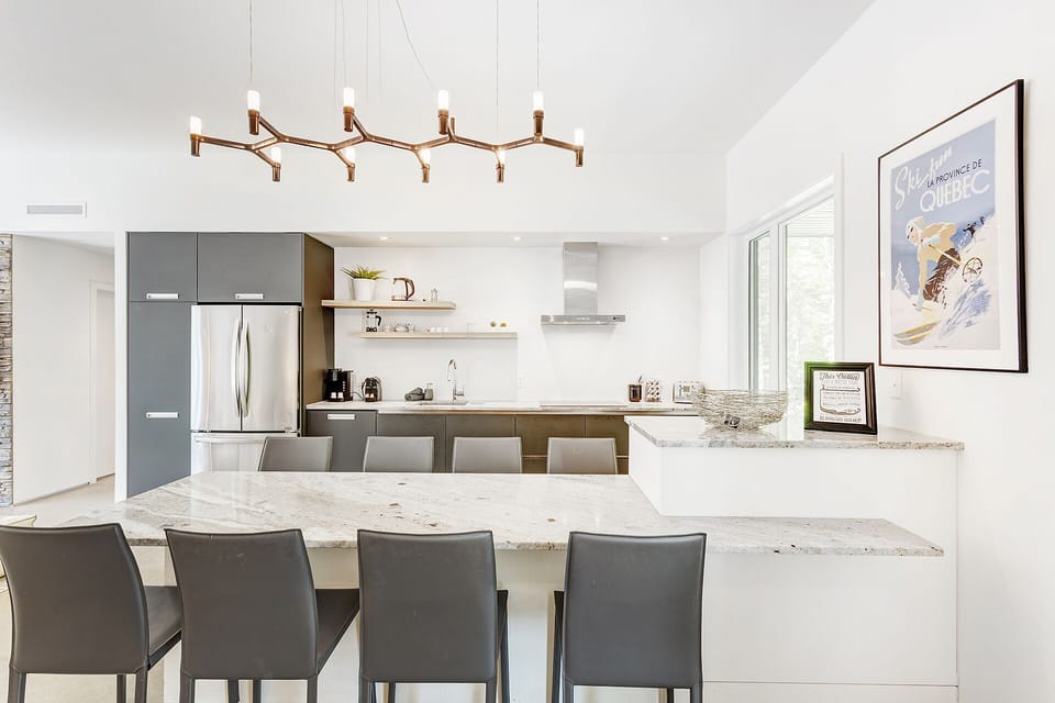 Gourmet kitchen with all appliances and coffee station.