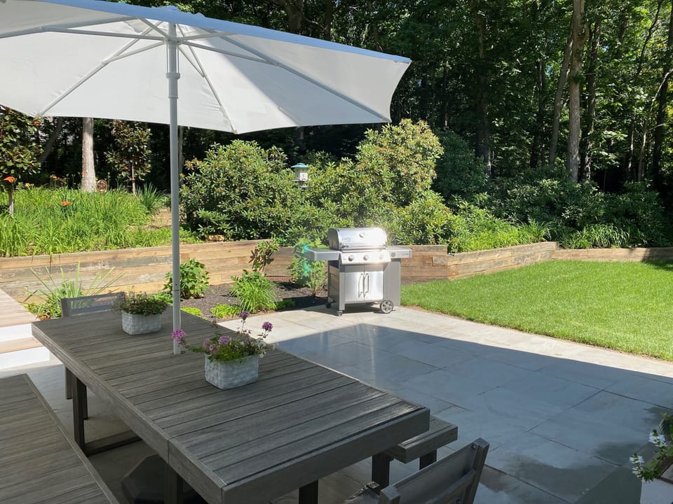 Large table, patio, new grill at Guest House.