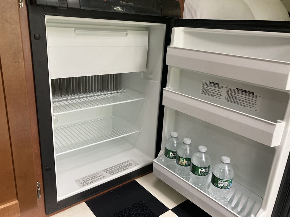 Refrigerator with compact freezer.