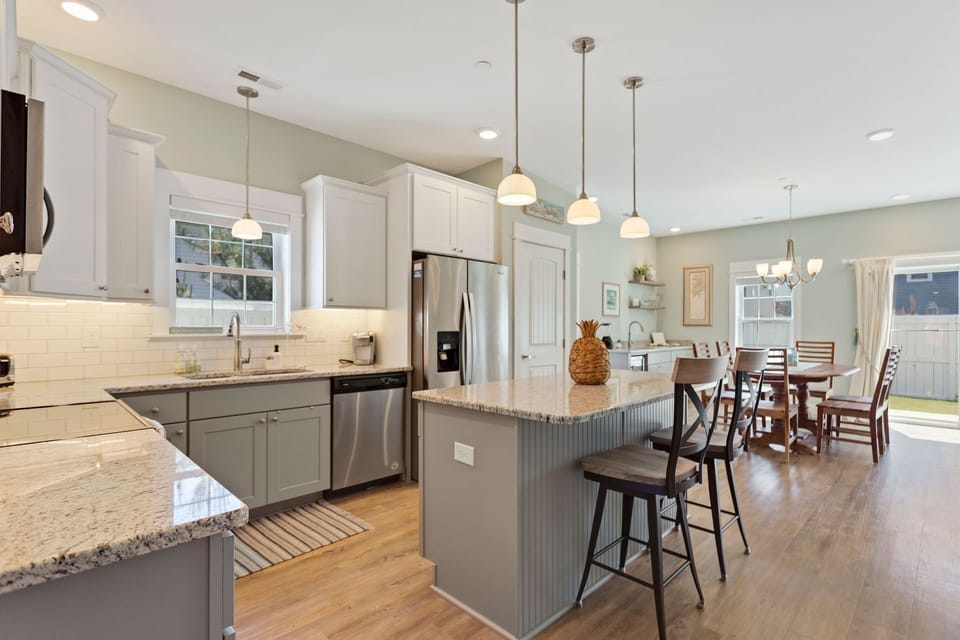 The modern Kitchen with granite countertops and stainless steel Whirpool Gold appliances is perfect for preparing an incredible meal.