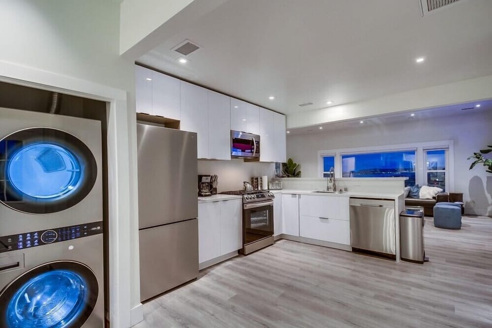 A fully stocked kitchen plus in-unit washer and dryer for added convenience during longer stays.