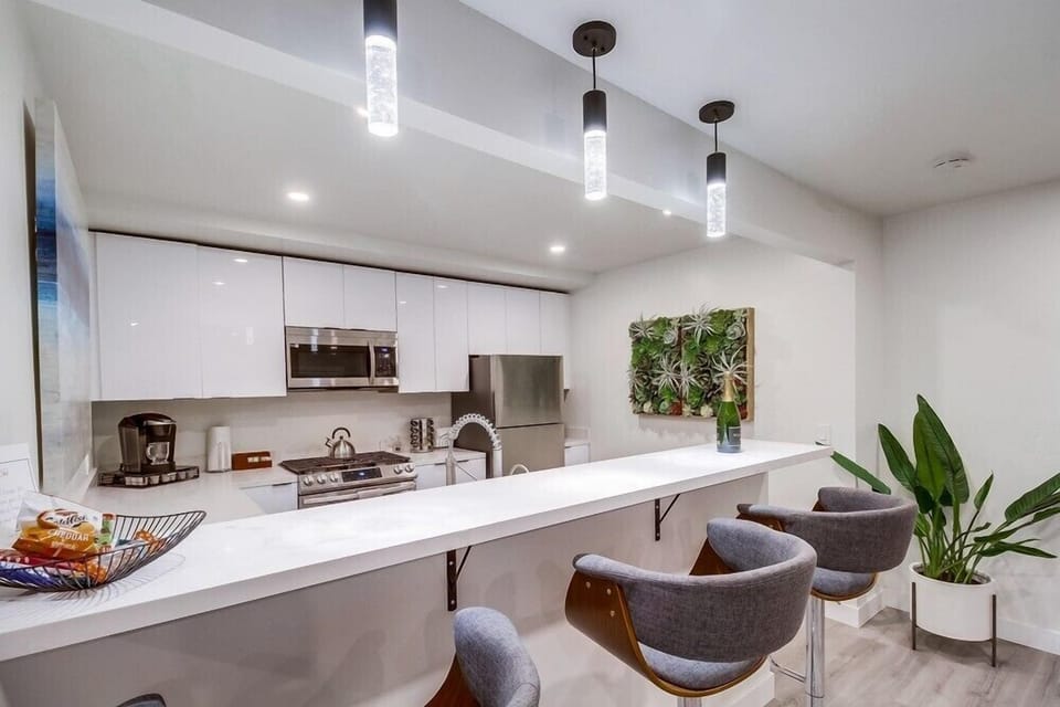 The fully equipped kitchen with bar seating makes it easy to cook, snack, and gather all at once.