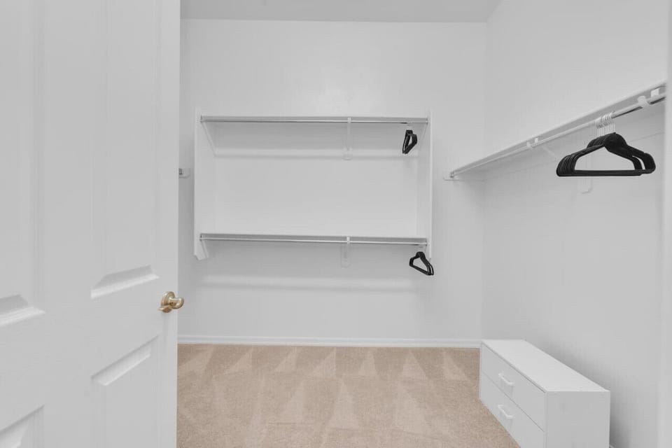 Primary bedroom`s large walk-in closet